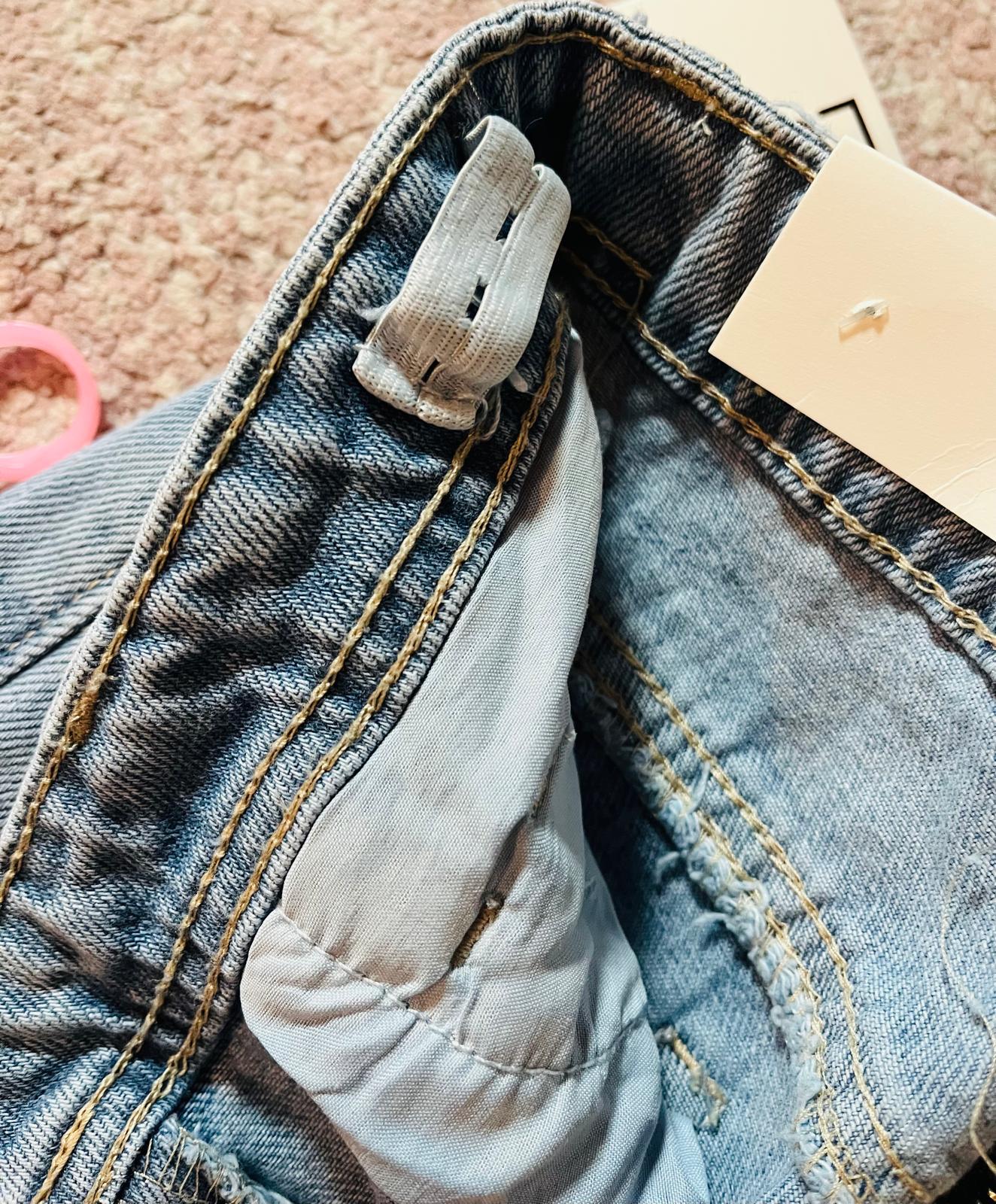 Jeans frangia e catena colorata